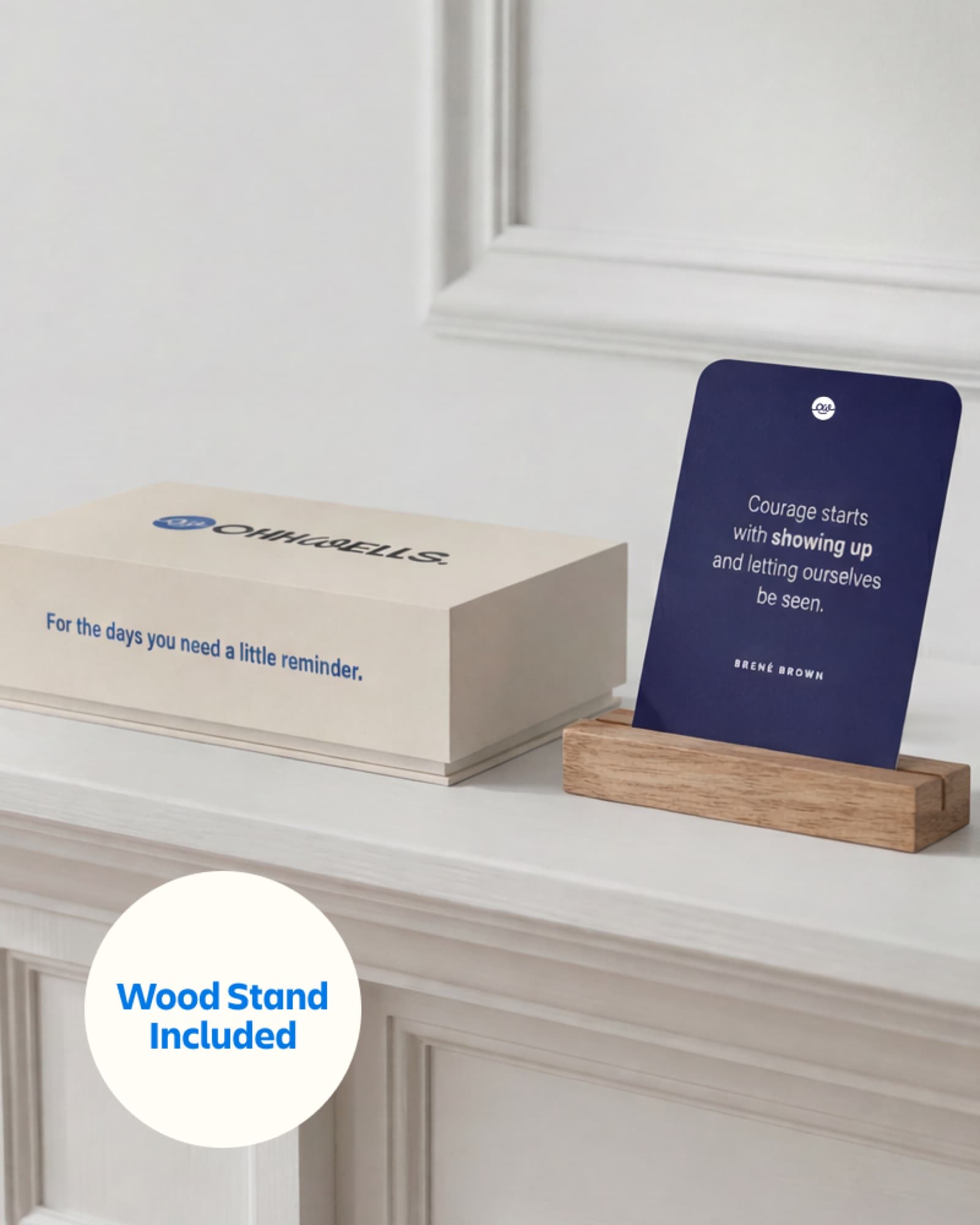 OhhWells SMB Survival Toolkit box with affirmation card on wooden desk stand